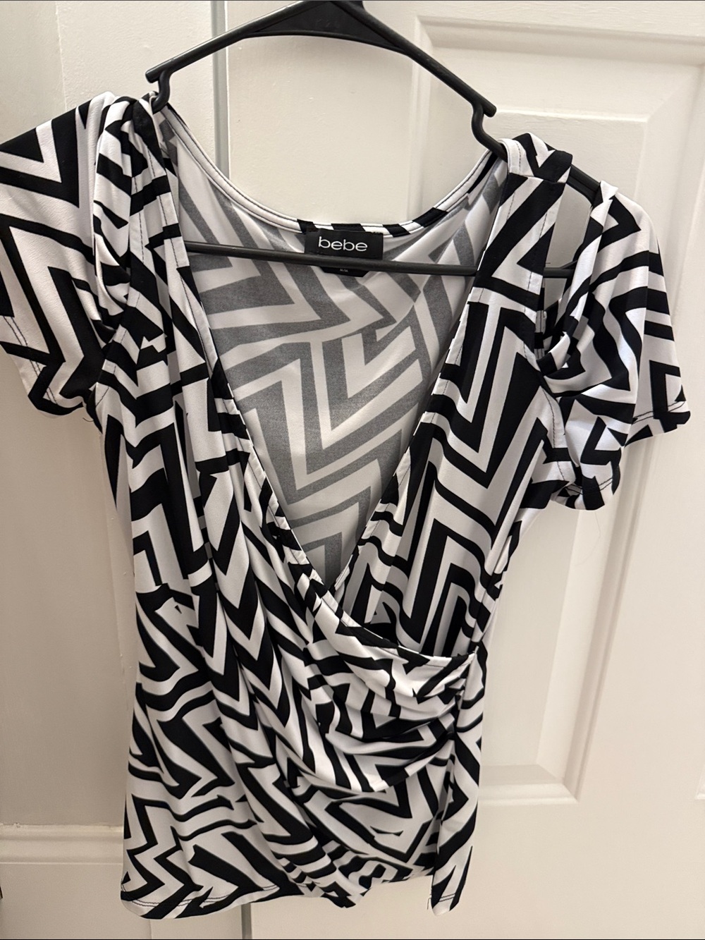 bebe Black & White Geometric Wrap-Style Blouse. Worn once